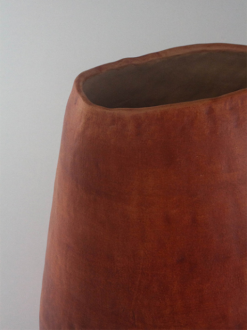 red vase made out of clay