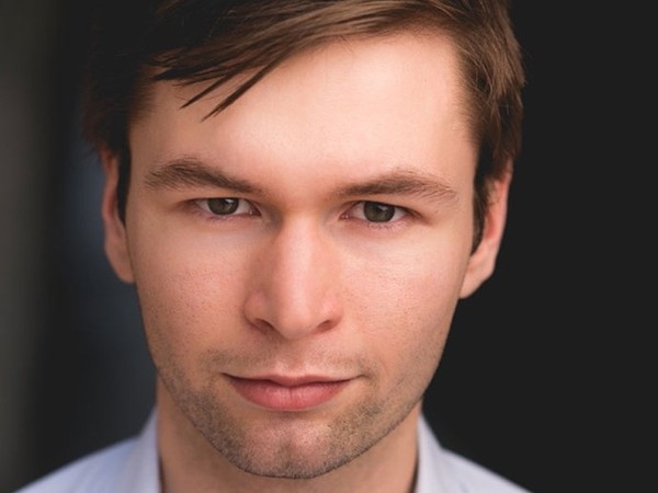 male staff smiling portrait