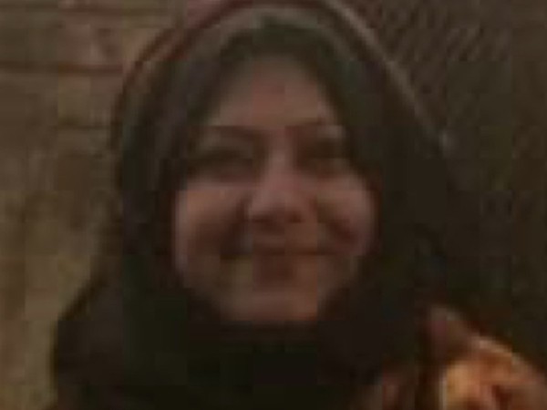 Dr Moutushi Tanha smiles to the camera.