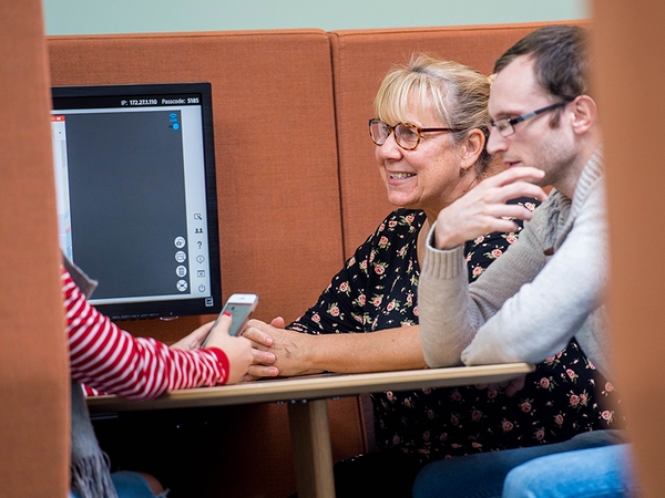 Staff and students working in a Pod
