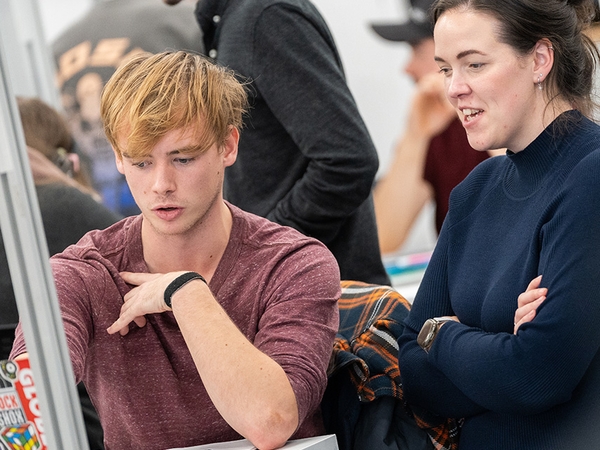 Student  in discussion with teacher