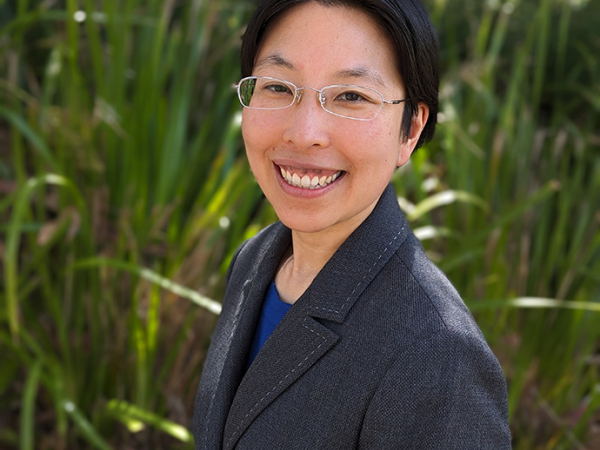 Dr Kelly Ngo smiles towards the camera.