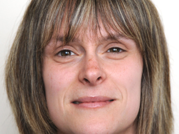 Dr Angharad Elias looks towards the camera.