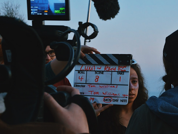 students filming using equipment 