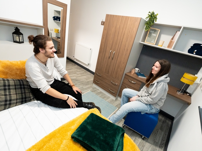 Two students chatting in student accommodation 