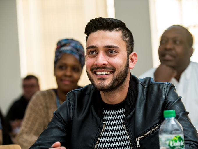 Student smiling in a classroom