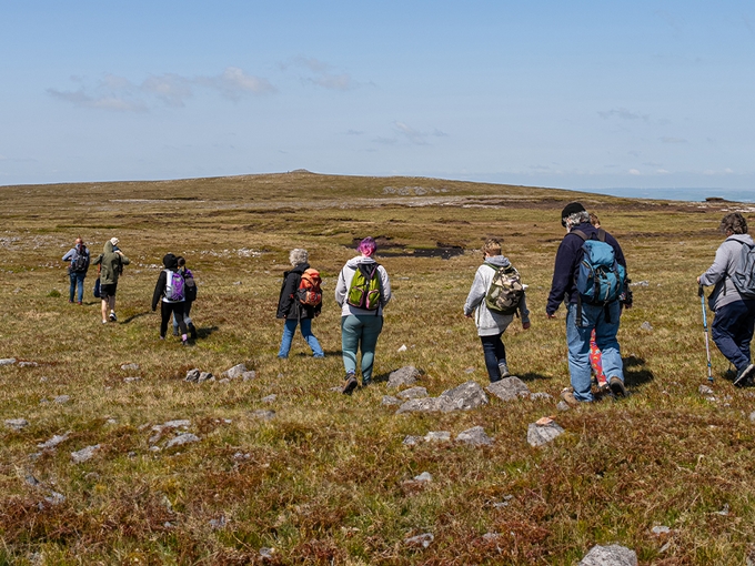 Group of people walking across a field