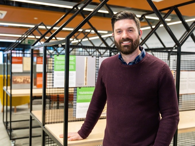 Alumnus Frank Claydon standing in UWTSD building Y Fforwm