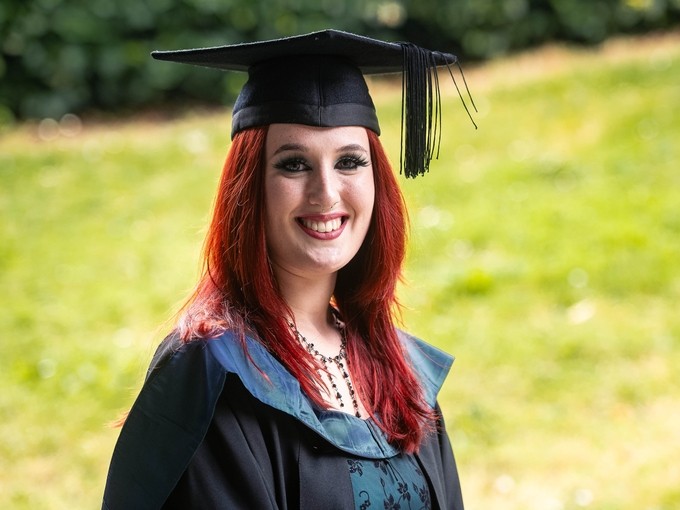 Girls with red hair in cap and gown