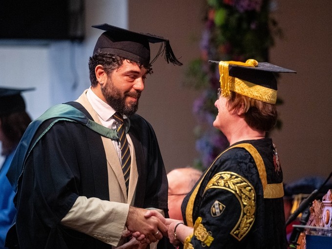 Alejo Matias Lopes Silva receives his bursary from Prof Elwen Evans