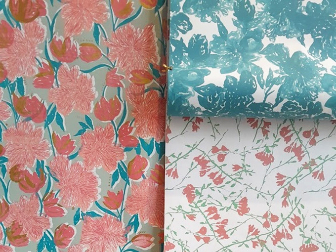 Floral-patterned samples of wallpaper.