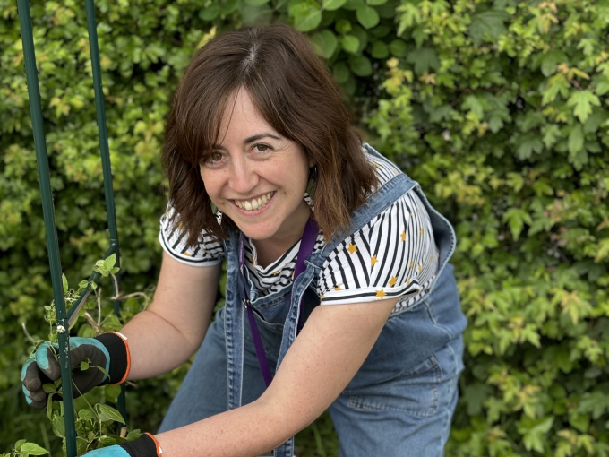 Image of Katrina Peters gardening with pupils