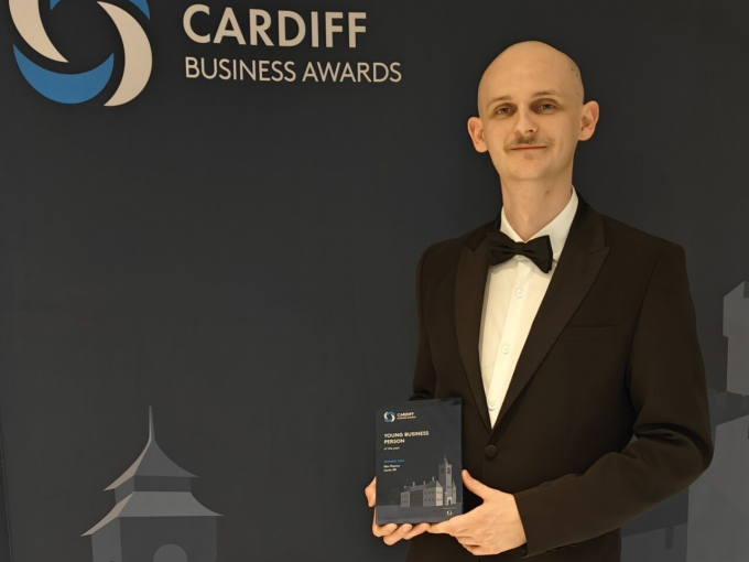 A man holding an award