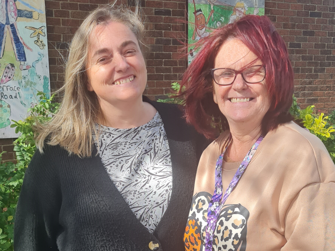 Two ladies smiling