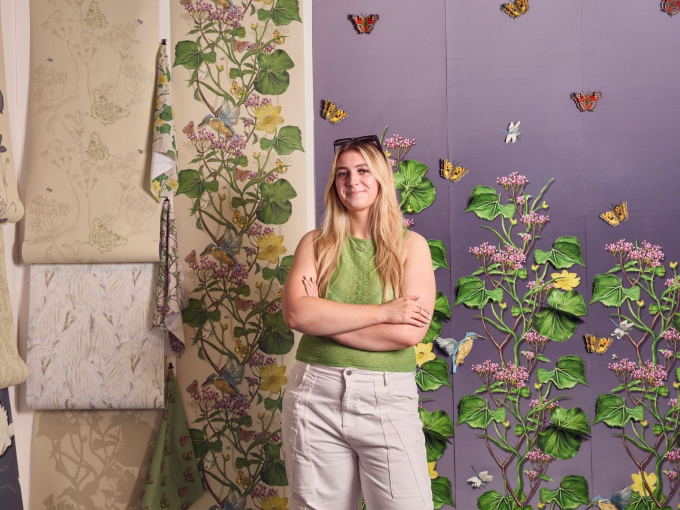 Anna Eynon with her textile display behind her