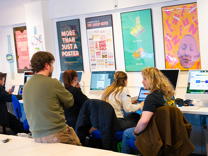 students using mac computers in workshop