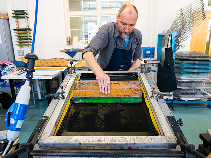 Man making bold art in studio