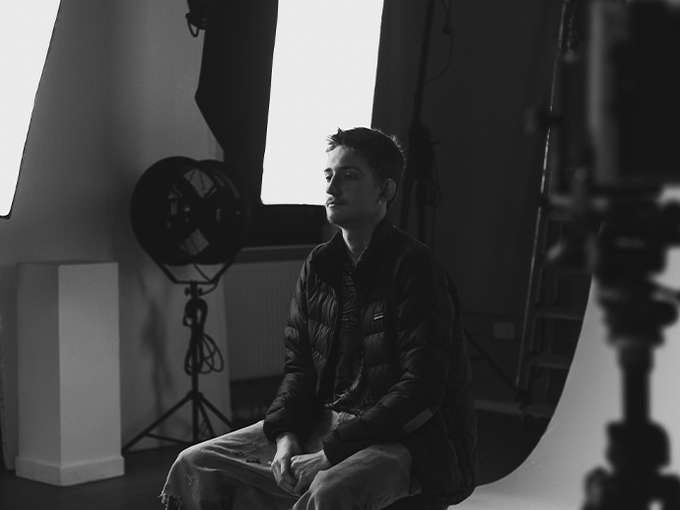 student sitting in studio chair