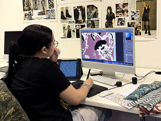 Mac lab room with student using computer
