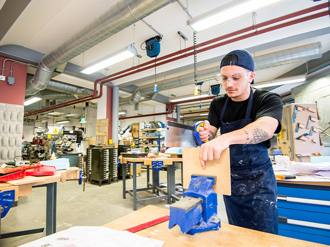 wood workshop student using facilities