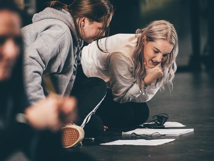 Two students looking at their script
