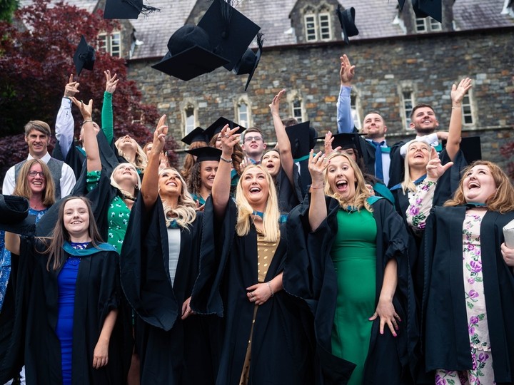 Students throwing mortar board