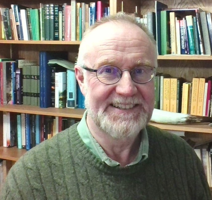 Headshots of Dr Alex Woolf in front of book shelf