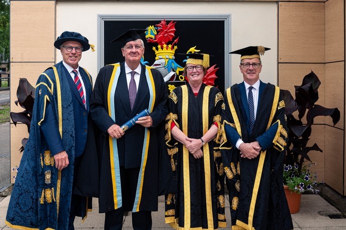 Gwilym Dyfri Jones, Andrew Curl, Elwen Evans and Emlyn Dole in graduation gowns