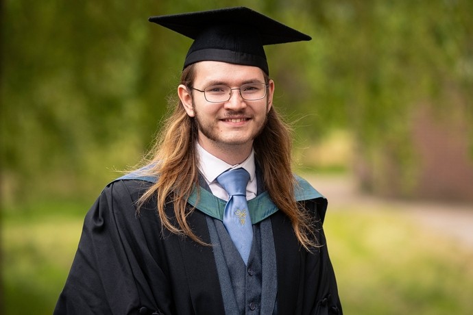 Isaac Law in graduation gown