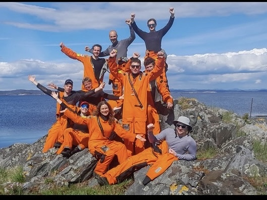 Elenya and her class mates on top of a mountain on a summer expedition 
