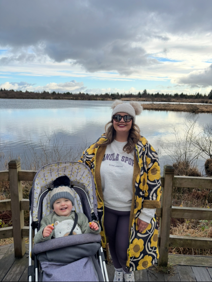 Liah Evans with her son in front of a lake