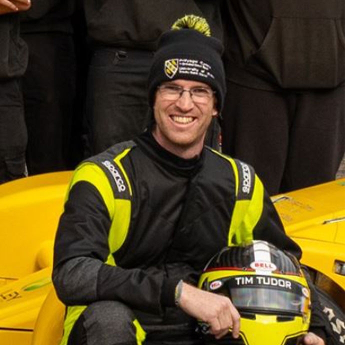 male holding a car helmet