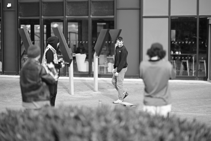 a group of students taking part in a workshop outside yr Egin 