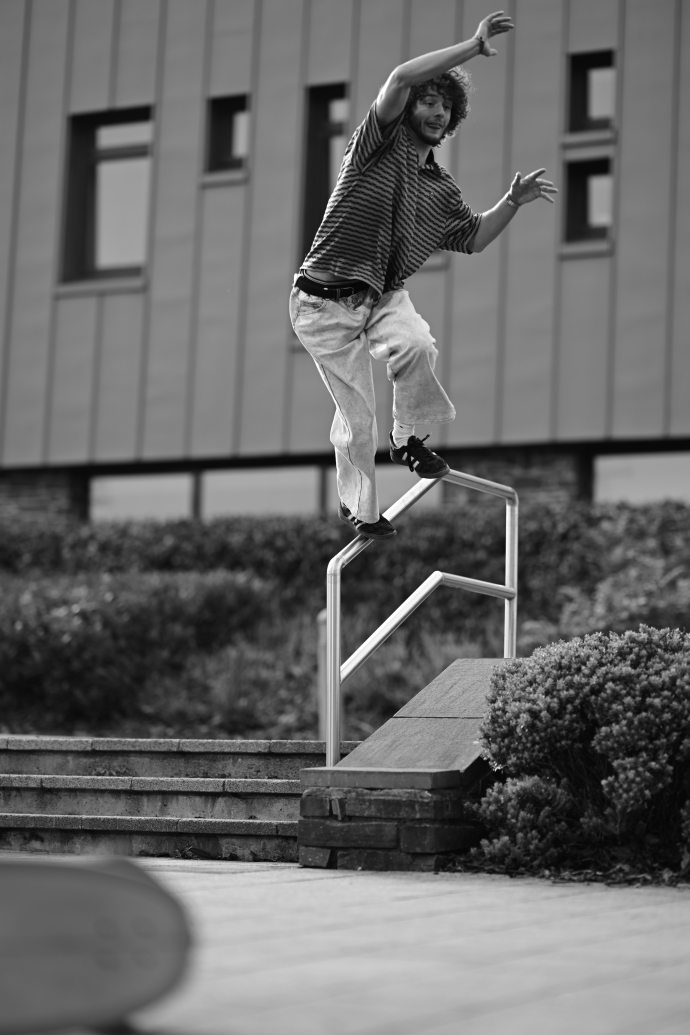 a student portrait of another student in the air jumping 