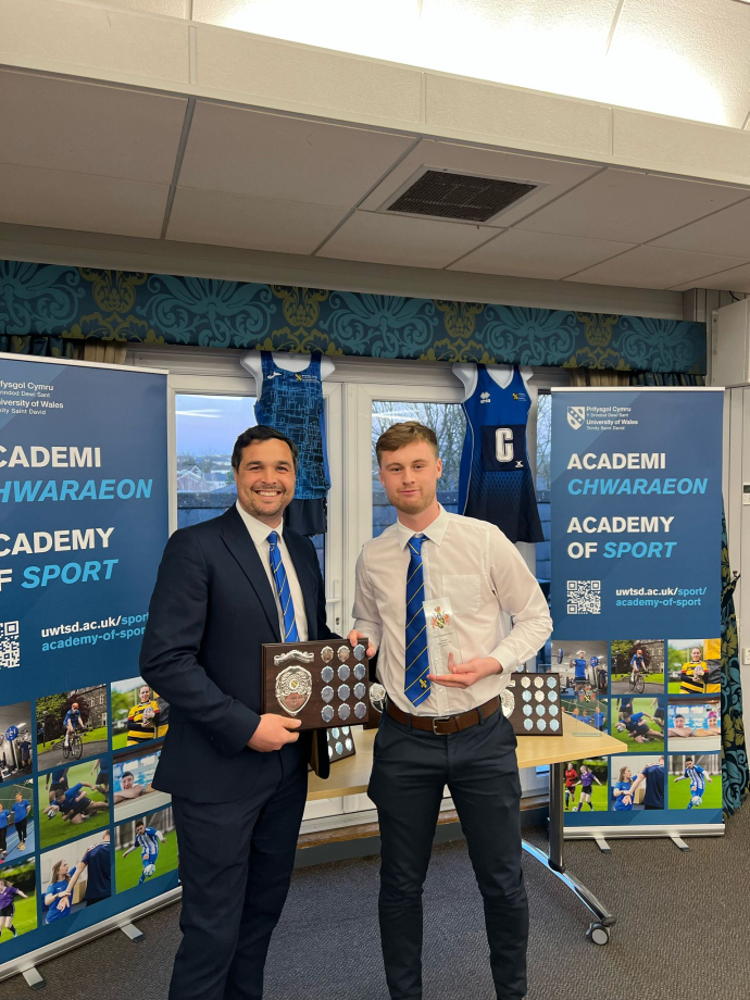 Luke McDonald receiving his award