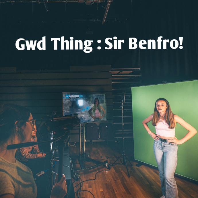 a girl in front of a green screen