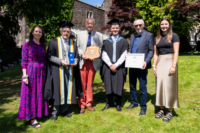group shot of Norah Isaac winner holding shield certificate with Carmarthen Civic Society