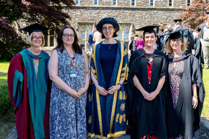a group of people in their cap and gown
