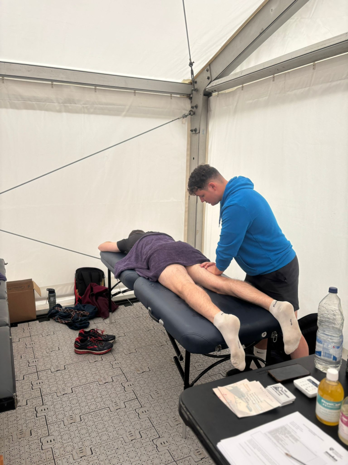 Cynyr treating a client during Ironman 