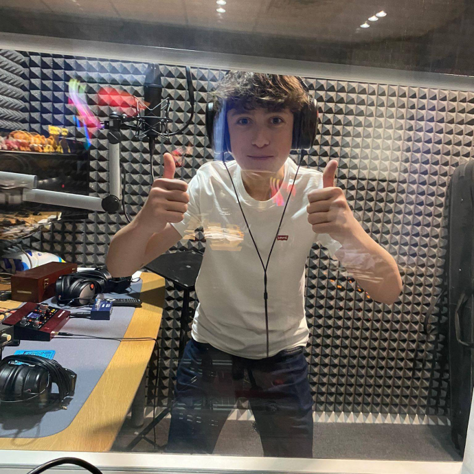 A picture of a young man wearing headphones
