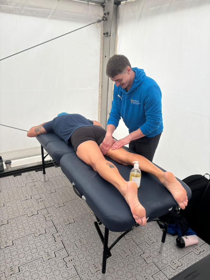 Sam Holland treating a client 