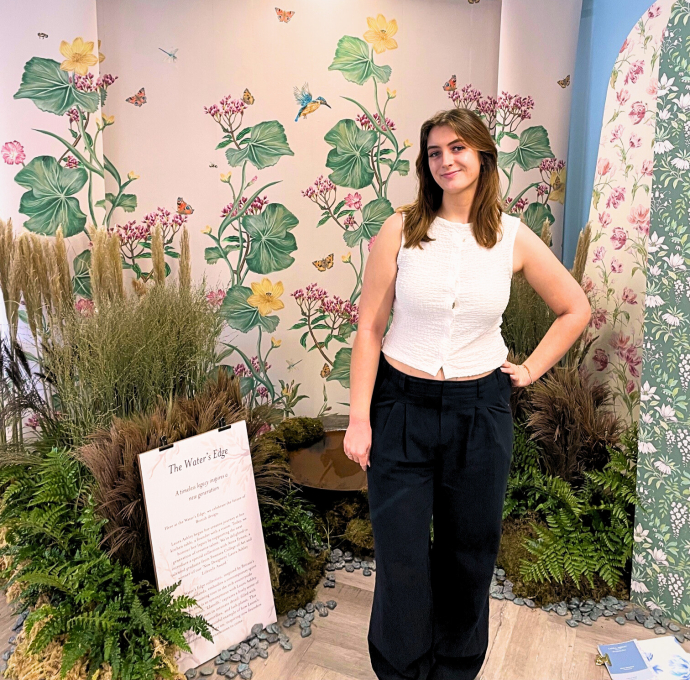 Anna Eynon with her textile display behind her