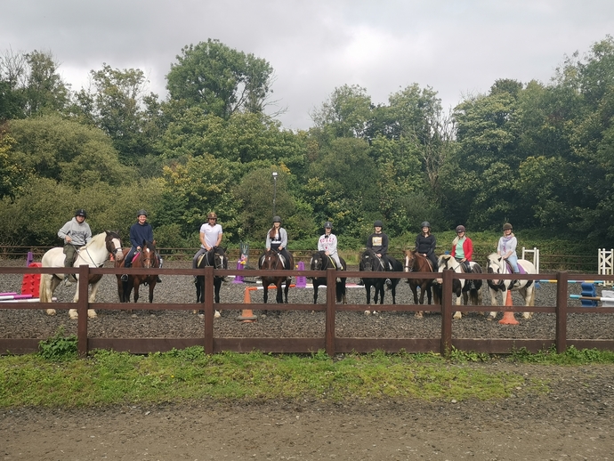 an image of a group of people riding horses