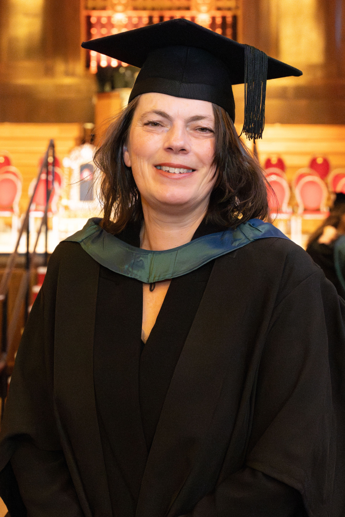 Emma-Jane Wilson in the Brangwyn Hall in her graduation gown 