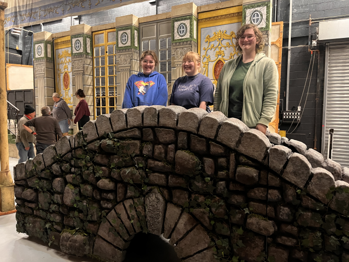 students standing on top of the bridge that they built