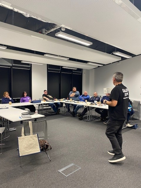 Marc Griffiths speaking with group members