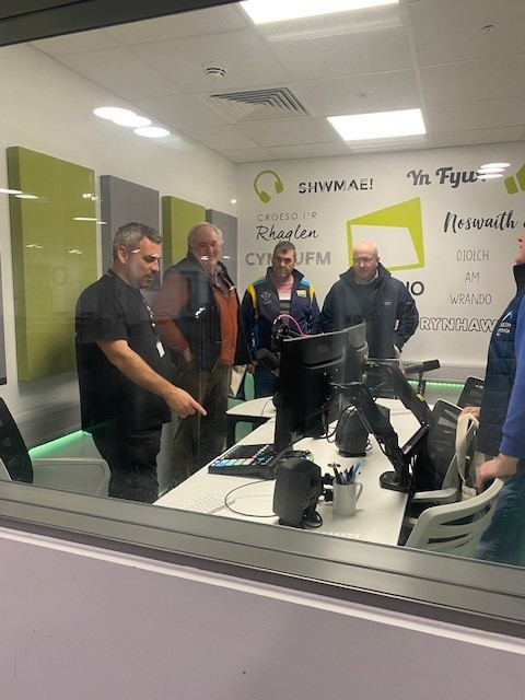 group of people sitting inside studio