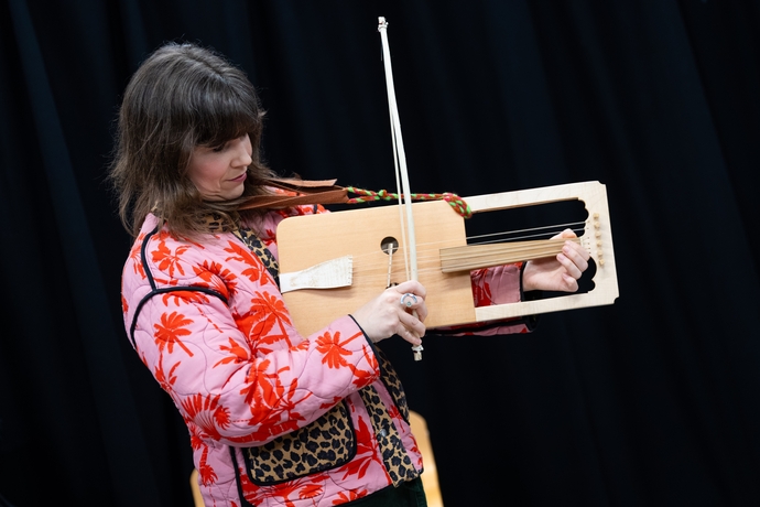 a picture of Angharad Jenkins playing the Crwth 