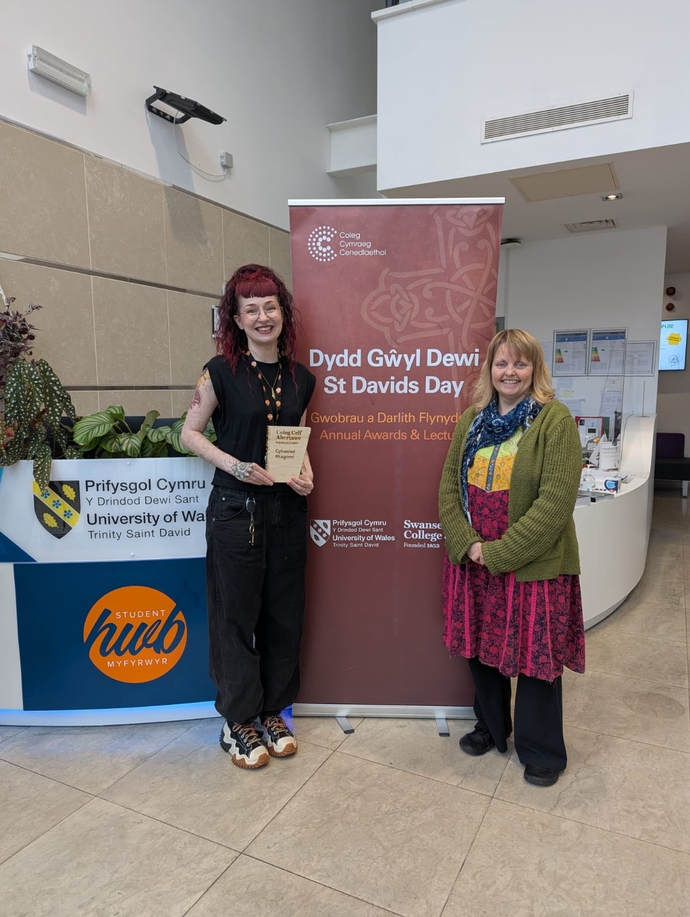 Gwenllian Beynon with Charlotte receiving his award