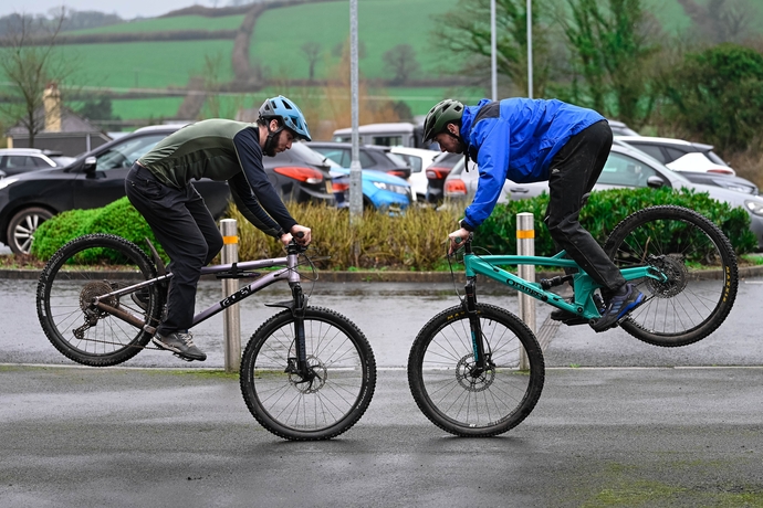 two adventure education students on bikes